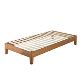 A wooden bed featuring slats, showcasing a simple and functional design suitable for various bedroom styles.